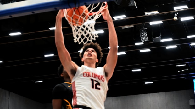 Cameron Boozer (12) from Miami Columbus dunks the ball to tie the game at the buzzer and send the FHSAA Class 7A state title game into overtime on Saturday at the RP Funding Center in Lakeland.